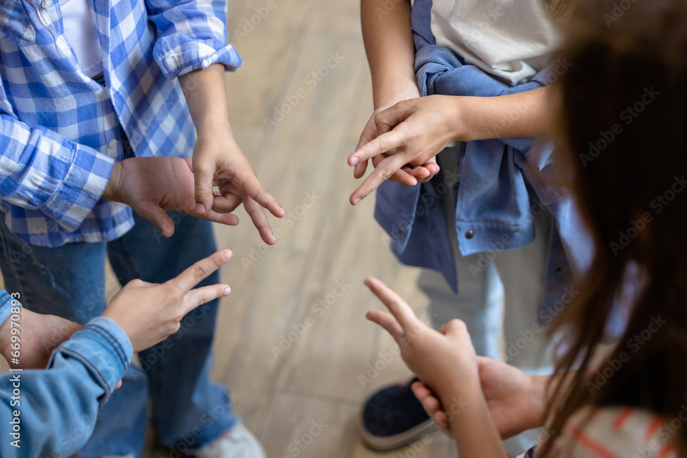 Kids playing finger game at break at school Kids playing finger game at break at school