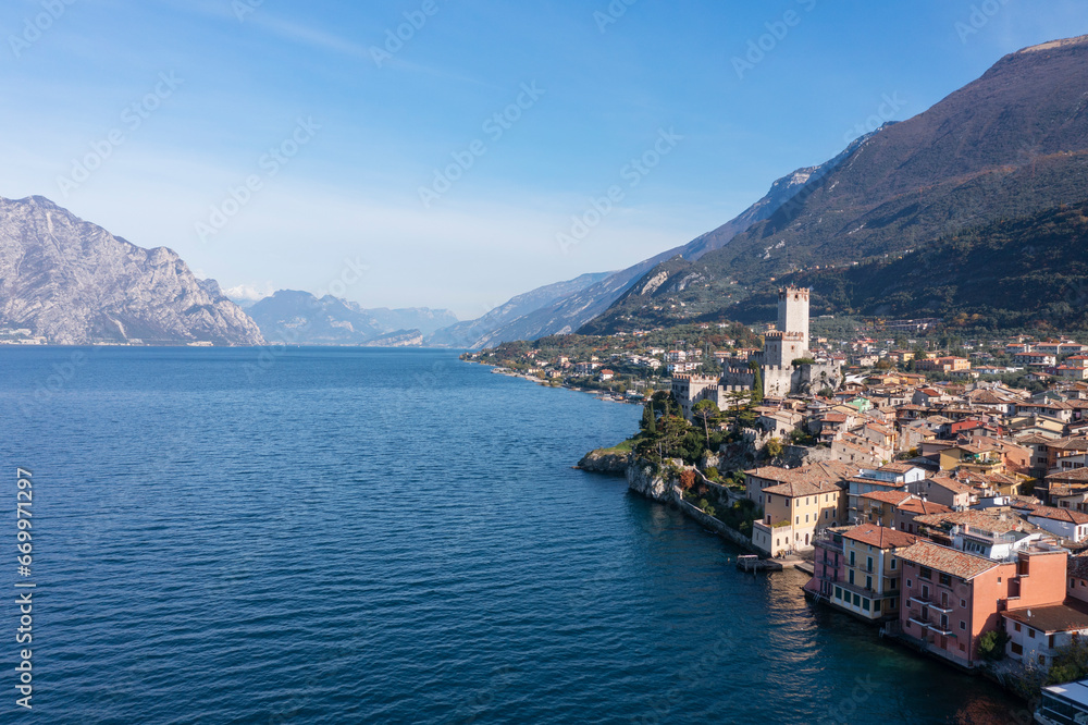 Italy, Malcesine, Aerial view of town on shore of Lake Garda Italy, Malcesine, Aerial view of town on shore of Lake Garda