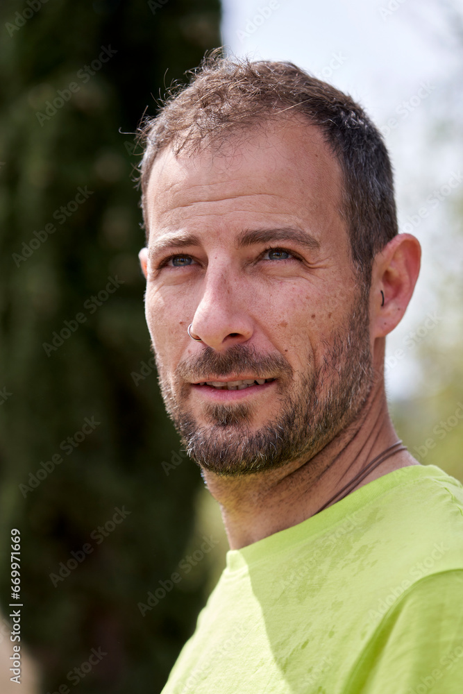 Contemplative man with hair stubble on sunny day Contemplative man with hair stubble on sunny day