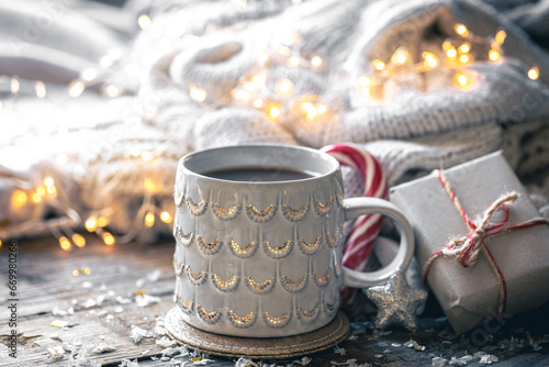 Winter composition with a cup of cocoa and decorative details.