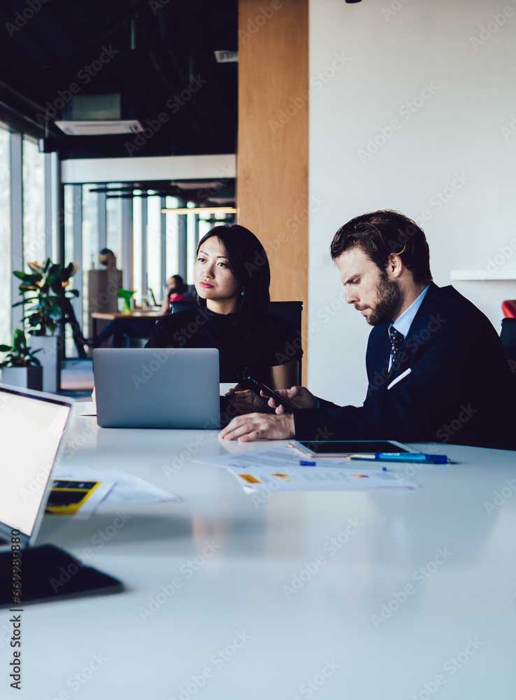 Group of successful multicultural employees brainstorming on startup during meeting in office Group of successful multicultural employees brainstorming on startup during meeting in office