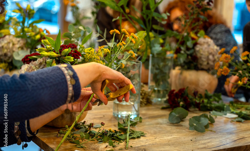 Fototapeta Naklejka Na Ścianę i Meble -  Natural flowers. Floral arrangement workshop with autumn flowers.