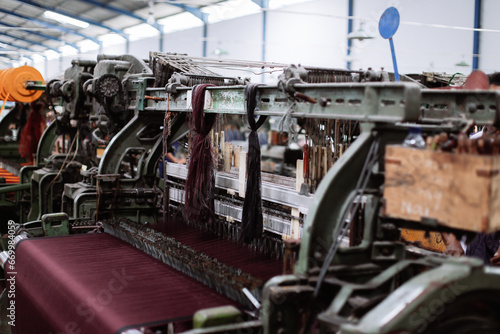 Production line of the textile industry. Industrial background. Selective focus. © satriaiswanda
