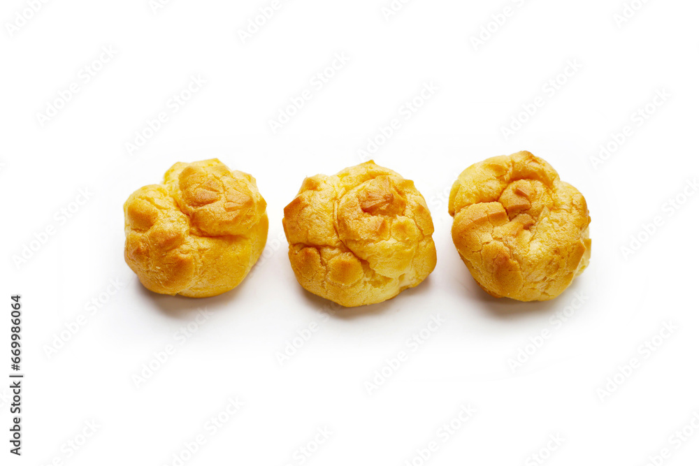 Cream puffs on white background