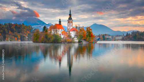 attractive morning view of pilgrimage church of assumption of maria impressive autumn scene of bled lake julian alps slovenia europe traveling concept background photo