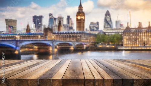 the empty wooden table top with blur background of london