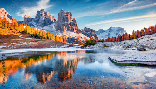 wonderful morning view of frozen limides lake spectacular autumn landscape of dolomite alps superb outdoor scene of falzarego pass italy europe beauty of nature concept background photo