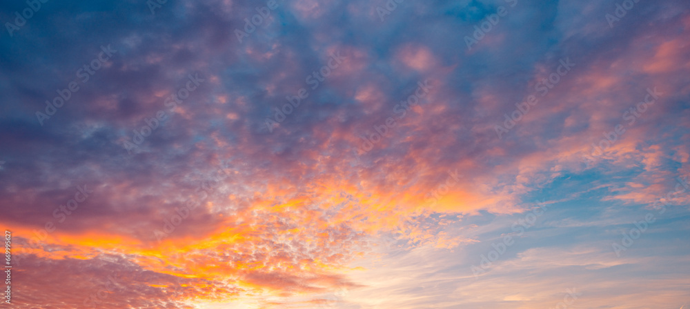 Fototapeta premium Majestic morning colorful sunlight sky clouds. Heavenly light reflected on fluffy clouds in golden hour. Bright sun beams rays over panoramic view in summer gorgeous season. Inspire peaceful skyscape