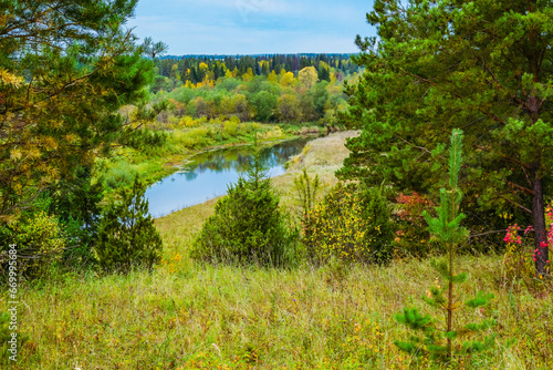 autumn landscape from a mountain with a forest and a river view