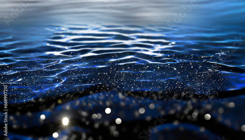 black water with ripples on the surface defocus blurred transparent blue colored clear calm water surface texture with splashes and bubbles water waves with shining pattern texture background