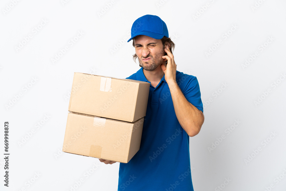 Delivery man isolated on white background frustrated and covering ears Delivery man isolated on white background frustrated and covering ears
