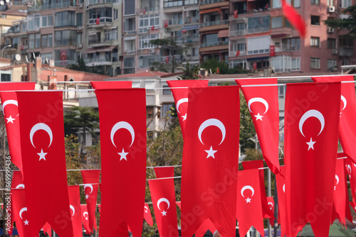 Lots of Turkish flags with building background. Turkey national day republic day indepence day concept.  photo