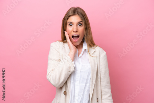 Young caucasian woman isolated on pink bakcground with surprise and shocked facial expression