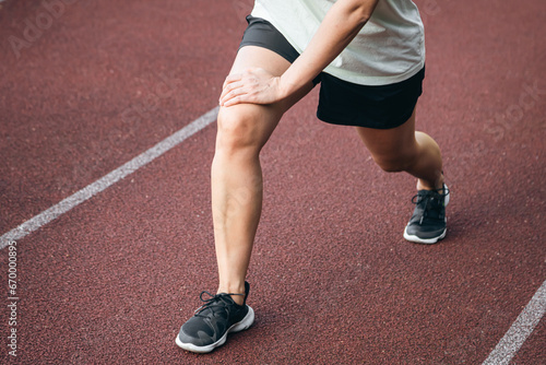 Sports, stretching and exercise with a woman outdoor on a track.