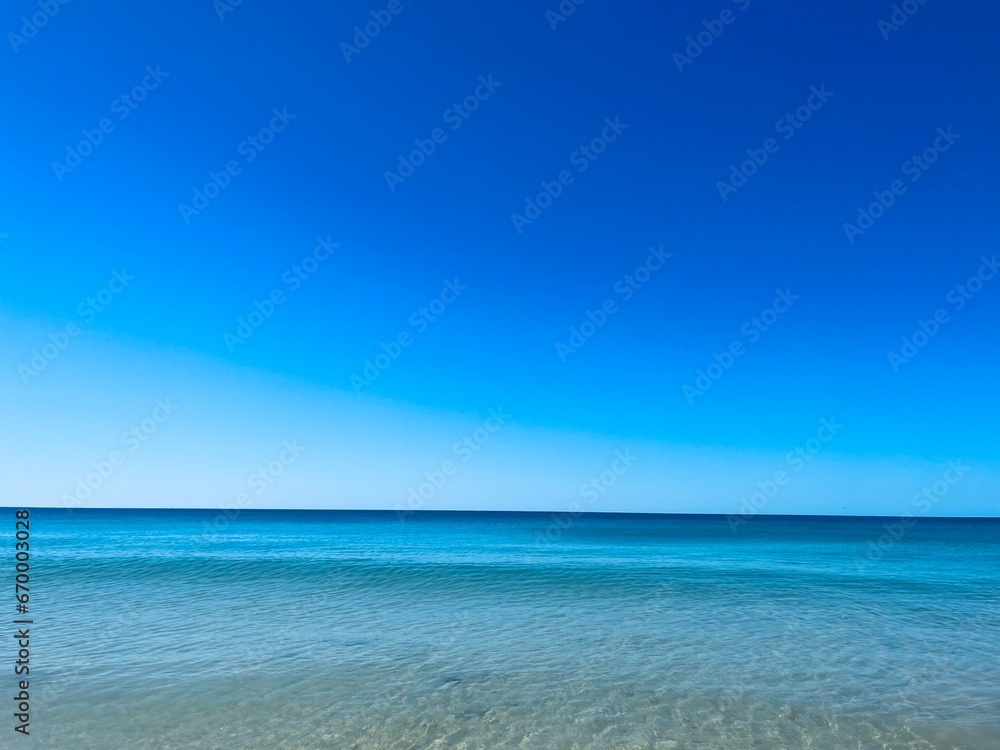 Transparent blue sea water, blue sea horizon, pure sky, natural blue seascape background