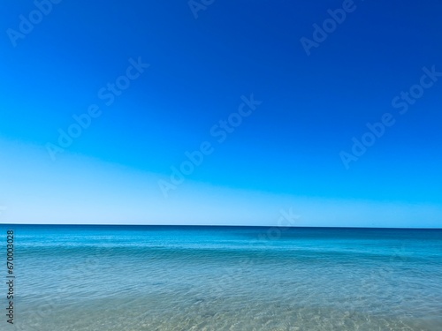 Fototapeta Naklejka Na Ścianę i Meble -  Transparent blue sea water, blue sea horizon, pure sky, natural blue seascape background