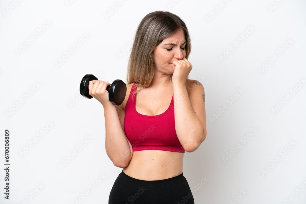 Young sport Rumanian woman making weightlifting isolated on white background having doubts Young sport Rumanian woman making weightlifting isolated on white background having doubts