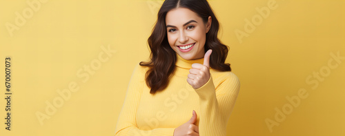 Portrait of a woman with thumb up
