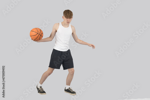 Teenage boy playing basketball © Ben Gingell