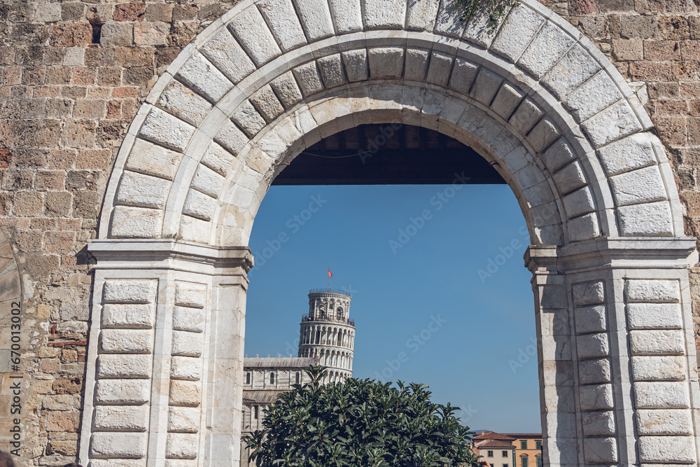 Fototapeta premium View through the wall arch of the bell tower of the Cathedral of Pisa, Tuscany, Italy, Europe.