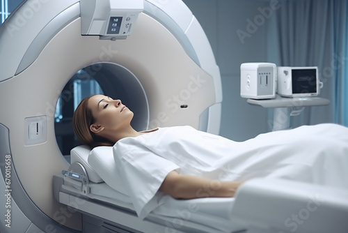 Female Doctor Looking At Patient Undergoing CT Scan, Doctor in uniform using tomography machine with lying patient in hospital