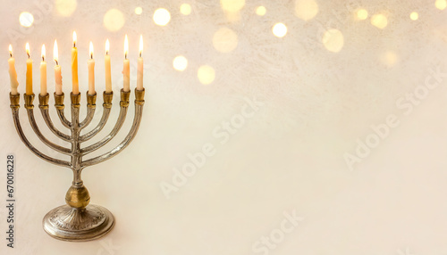 Jewish Hanukkah Menorah candlestick on a blurred background.