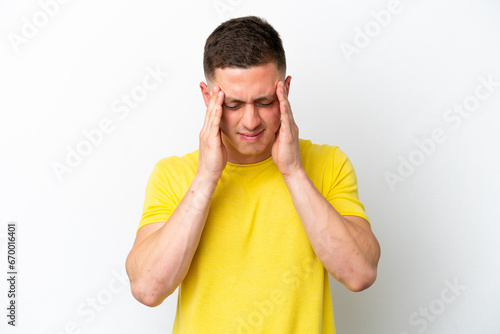 Young brazilian man isolated on white background with headache