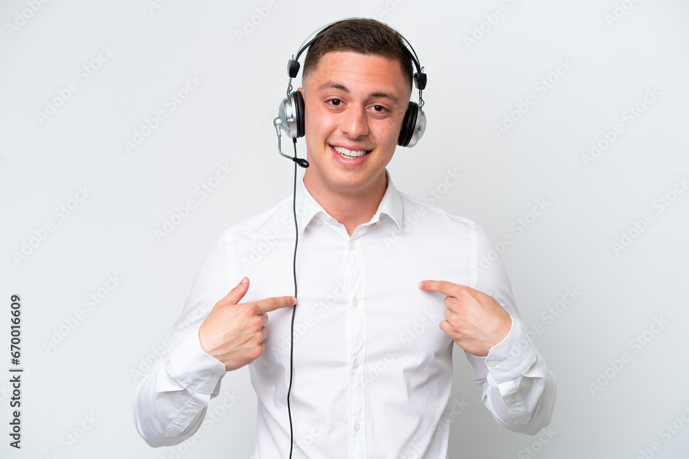 Telemarketer Brazilian man working with a headset isolated on white background with surprise facial expression Telemarketer Brazilian man working with a headset isolated on white background with surprise facial expression