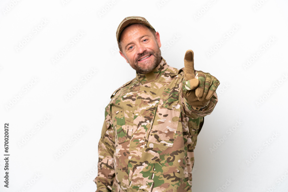 Military man isolated on white background showing and lifting a finger Military man isolated on white background showing and lifting a finger