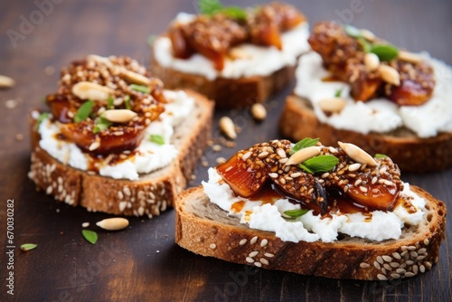 close-up of multi-grain bruschetta with ricotta and fig slices
