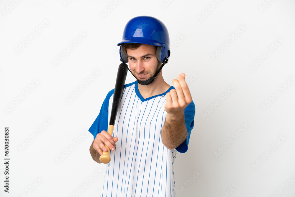 Young caucasian man playing baseball isolated on white background making money gesture