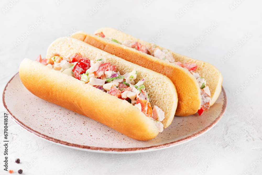 Chopped Italian sandwich in hot dog buns in a plate. Chopped Italian sandwich in hot dog buns in a plate.