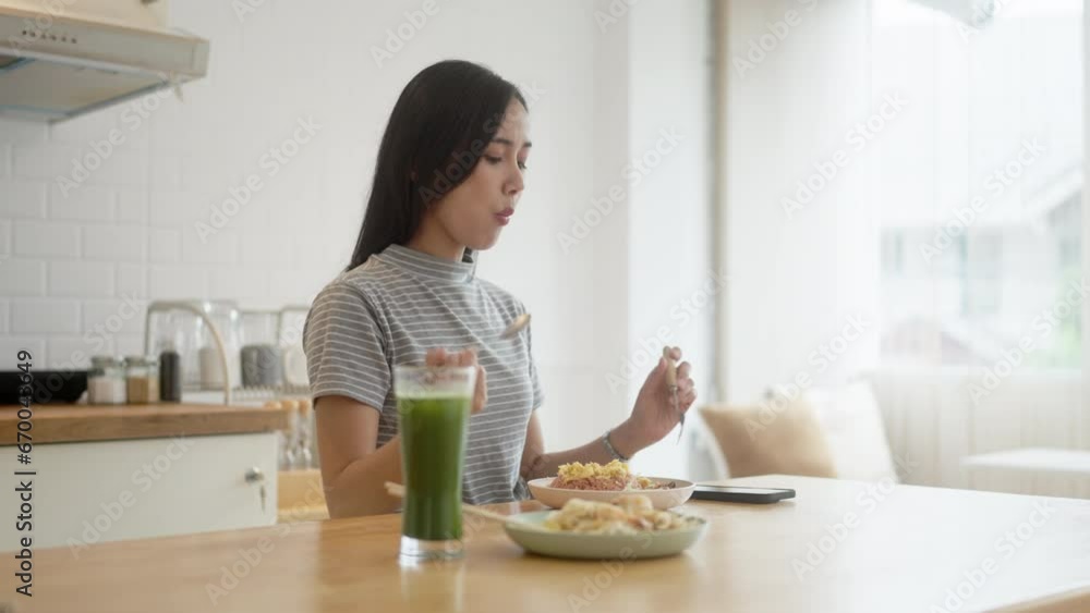 Asian woman eating traditional thai food at home, Asian Tasty dish. Asian woman eating traditional thai food at home, Asian Tasty dish.