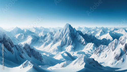 Panoramic photo of snow-covered mountains with sharp peaks  the skies above are clear blue