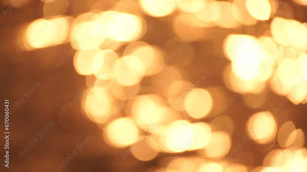 Abstract Blurred video screensaver bokeh golden sea at sunset. The sun reflects and sparkles on the waves. Abstract Blurred video screensaver bokeh golden sea at sunset. The sun reflects and sparkles on the waves.