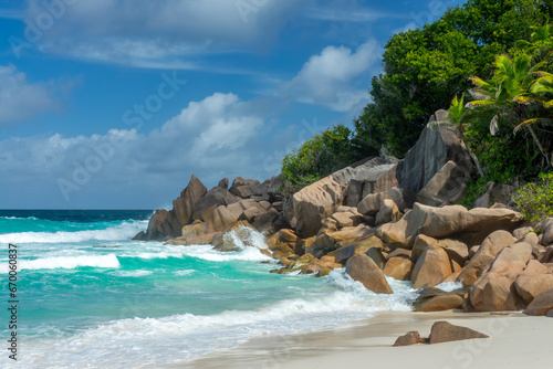 Granite rocks on the scenic tropical beach of Petite Anse, La Digue island, Seychelles