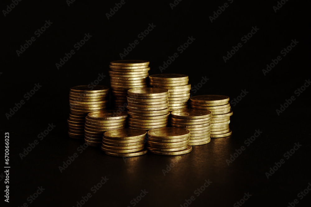 Gold coins on black background, Saving money concept Gold coins on black background, Saving money concept