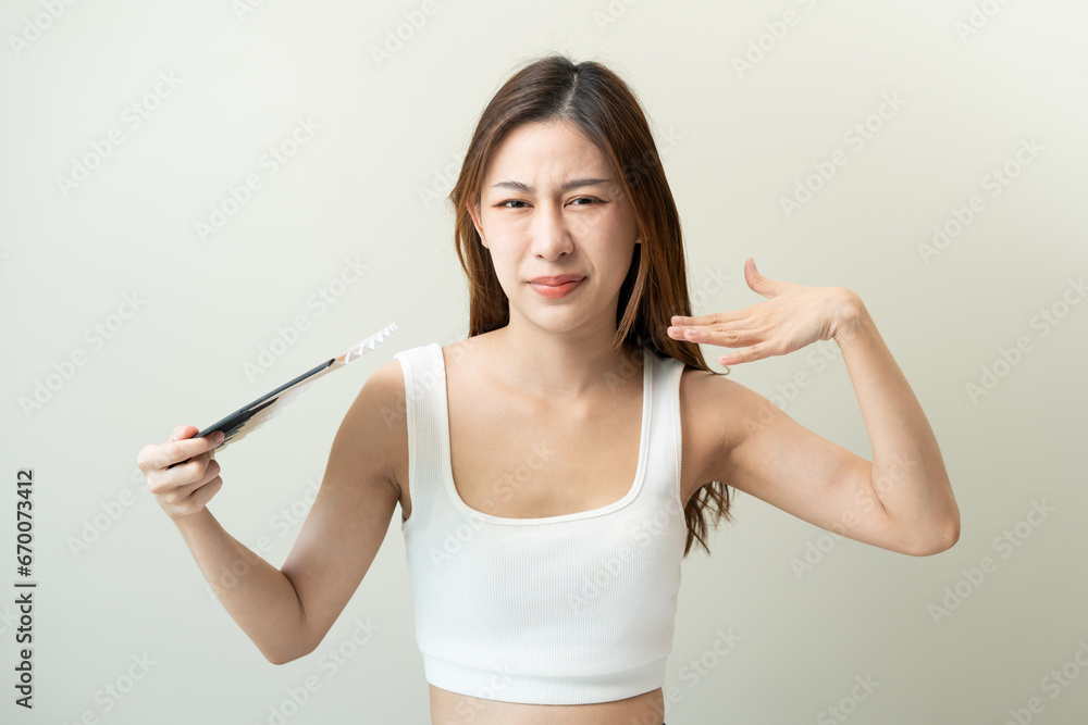 Face expression of human. Asian beautiful female expression feeling hot weather in the summer day in studio shoot yellow background. Face expression of human. Asian beautiful female expression feeling hot weather in the summer day in studio shoot yellow background.