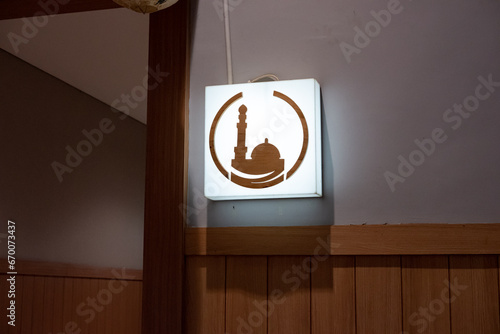 Moslem prayer room logo located in a shopping mall. photo