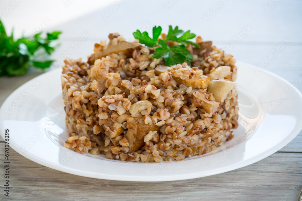 cooked buckwheat boiled with mushroom filling in a plate cooked buckwheat boiled with mushroom filling in a plate