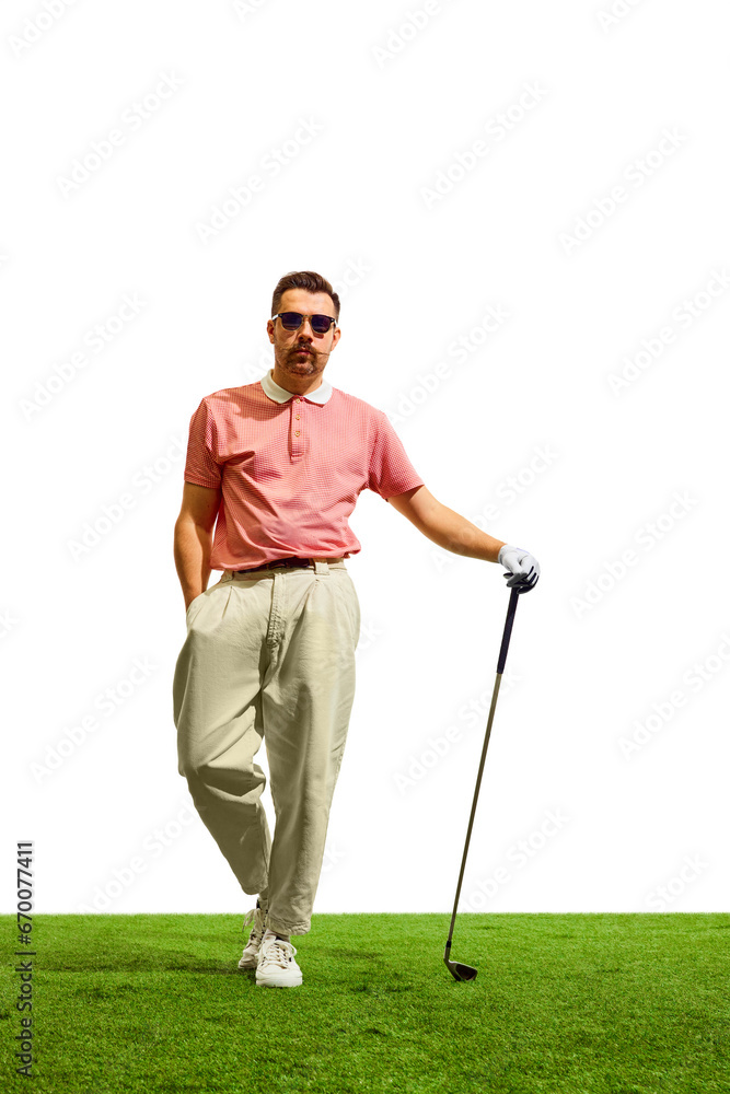 Full length portrait of confident professional golfer player stands on green grass at golf club in summer time. Golfer's focus, unwavering and determined. Full length portrait of confident professional golfer player stands on green grass at golf club in summer time. Golfer's focus, unwavering and determined.