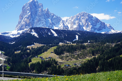 Rural pathway road and hedge fence with Santa Maddalena Landscape at Val di Funes, land of the pale mountains and beautiful valley in the Dolomites one of UNESCO World Heritage- South Tyrol, Italy