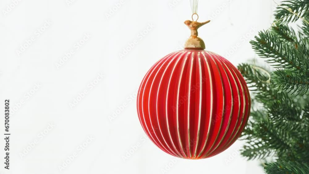 Red glass ball decorated Christmas tree on branch snow on white background family holiday. Happy New Year. Noel. Winter holidays concept. Red glass ball decorated Christmas tree on branch snow on white background family holiday. Happy New Year. Noel. Winter holidays concept.