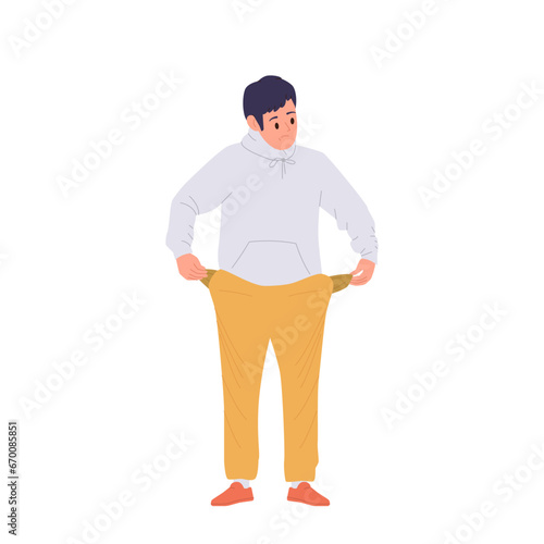 Depressed young boy student demonstrating empty pants pockets isolated on white background