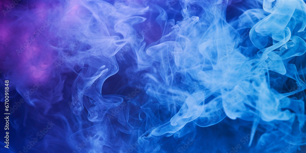 Blue Ink in water. Abstract background. Smokey clouds of ink swirling in liquid.