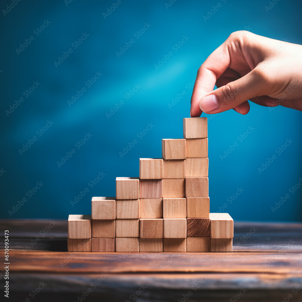 Wooden block stacking as step stair for business growth success concept.
Wooden block stacking as step stair for business growth success concept.