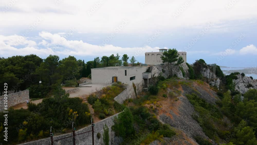 Aerial video of Mémorial du Débarquement et de la Libération en Provence. Footage was shot from a drone at a higher altitude, while flying backwards from the monument, on a rainy day. Aerial video of Mémorial du Débarquement et de la Libération en Provence. Footage was shot from a drone at a higher altitude, while flying backwards from the monument, on a rainy day.