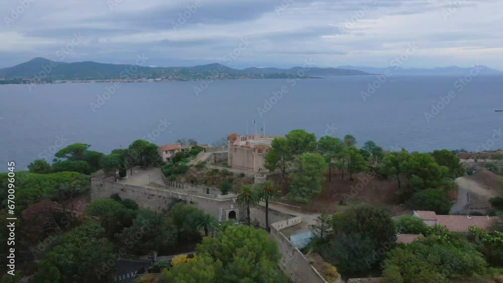 Aerial view of the fort in Saint-Tropez. footage was shot from a drone at a higher altitude, flying around the citadel of Saint-tropez in an orbital trajectory. Aerial view of the fort in Saint-Tropez. footage was shot from a drone at a higher altitude, flying around the citadel of Saint-tropez in an orbital trajectory.