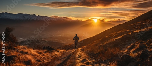 Trail Runner running on the mountain, at sunrise
