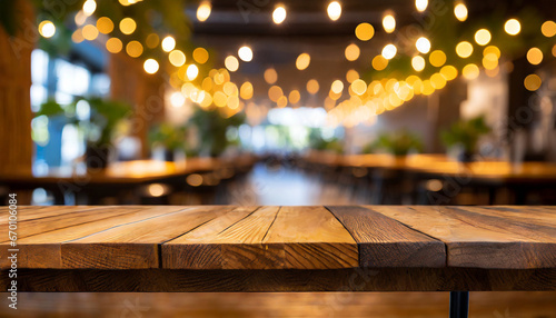 empty wooden table and blurred background of hall of stage bar or cafe with bokeh lights high quality photo photo